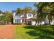 Delightful home with a two-car garage, well-kept lawn, and vibrant flowers, perfect for comfortable living at 4605 W Vasconia St, Tampa, FL 33629