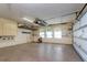 Spacious garage with epoxy floors, three windows, overhead storage and side mounted cabinetry at 4605 W Vasconia St, Tampa, FL 33629