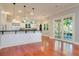 Modern kitchen with stainless steel appliances, granite countertop bar, and large glass doors to patio at 4605 W Vasconia St, Tampa, FL 33629