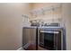 Efficient laundry room features modern washer, dryer, and wire shelving for optimal storage solutions at 4605 W Vasconia St, Tampa, FL 33629