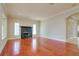 Spacious living room with hardwood floors and a fireplace for cozy evenings at 4605 W Vasconia St, Tampa, FL 33629