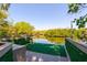 Inviting waterfront view featuring a wooden deck with railings and the waterway beyond at 4605 W Vasconia St, Tampa, FL 33629
