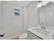 Updated half bathroom with modern vanity, mirror, and fixtures at 4720 50Th N Ave, St Petersburg, FL 33714