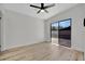 The bedroom features hardwood floors and a sliding glass door that allows plenty of light at 4720 50Th N Ave, St Petersburg, FL 33714