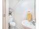 Cozy half-bathroom with a clean white design featuring a pedestal sink and space saving shelving at 506 S Willow Ave # 7, Tampa, FL 33606