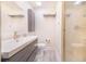 Bright bathroom features a sleek vanity, modern fixtures, and a glass-enclosed shower at 506 S Willow Ave # 7, Tampa, FL 33606