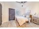 Cozy bedroom with a door to the deck, comfortable queen bed and stylish furnishings at 506 S Willow Ave # 7, Tampa, FL 33606