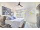 Bright bedroom with a ceiling fan, bay windows, and stylish decor at 506 S Willow Ave # 7, Tampa, FL 33606