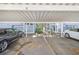 Assigned carport parking for residences in a well-maintained community setting with adjacent landscaping at 506 S Willow Ave # 7, Tampa, FL 33606