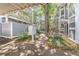 Charming exterior view showcasing lush landscaping, walkways, and well-maintained building facades at 506 S Willow Ave # 7, Tampa, FL 33606