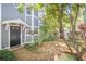Inviting front entrance to a two-story home featuring a well maintained yard and beautiful trees at 506 S Willow Ave # 7, Tampa, FL 33606
