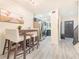 Bright kitchen and entry area features a table with seating and stainless steel refrigerator at 506 S Willow Ave # 7, Tampa, FL 33606