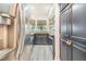 Compact kitchen features stainless steel appliances, dark cabinetry, and granite countertops at 506 S Willow Ave # 7, Tampa, FL 33606