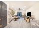 Comfortable living room features a plush sofa, modern decor, and a large television for entertainment at 506 S Willow Ave # 7, Tampa, FL 33606
