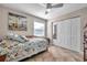 Cozy bedroom features a ceiling fan, window, and closet with mirrored doors at 5101 Coquina Key Se Dr # A, St Petersburg, FL 33705