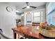 Bright dining area with adjacent laundry, modern ceiling fan, and a view into the kitchen at 5101 Coquina Key Se Dr # A, St Petersburg, FL 33705