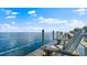 Scenic dock with Adirondack chairs overlooking calm ocean waters, ideal for relaxation and enjoying the view at 5101 Coquina Key Se Dr # A, St Petersburg, FL 33705