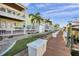A side view showcases the property's dock access and waterfront views, adjacent to a neatly kept walkway at 5101 Coquina Key Se Dr # A, St Petersburg, FL 33705