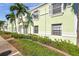 The building has a light green facade and neatly maintained landscaping which adds curb appeal at 5101 Coquina Key Se Dr # A, St Petersburg, FL 33705