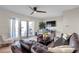 Spacious living room with modern ceiling fan, comfortable seating and access to outdoor patio at 5101 Coquina Key Se Dr # A, St Petersburg, FL 33705