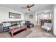 Inviting living room seamlessly connects to the dining area with tile flooring and ceiling fan at 5101 Coquina Key Se Dr # A, St Petersburg, FL 33705
