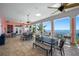 Spacious patio with tables, chairs, ceiling fans, and stunning ocean views providing a relaxing atmosphere at 5101 Coquina Key Se Dr # A, St Petersburg, FL 33705