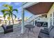 Comfortable patio seating overlooks the canal and boat dock, perfect for entertaining at 5101 Coquina Key Se Dr # A, St Petersburg, FL 33705