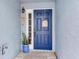 Charming blue front door with decorative accents and a welcoming atmosphere at 545 Pinellas Bayway S # 108, St Petersburg, FL 33715