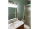 Bathroom vanity with modern fixtures and glass shower at 6070 80Th N St # 109, St Petersburg, FL 33709