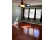 Bedroom featuring ceiling fan, hardwood floors, and a window at 6070 80Th N St # 109, St Petersburg, FL 33709