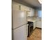 Bright kitchen with stainless steel stove, microwave, and ample cabinet space at 6070 80Th N St # 109, St Petersburg, FL 33709