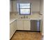Kitchen featuring white cabinets, laminate countertops, and stainless steel appliances at 6070 80Th N St # 109, St Petersburg, FL 33709