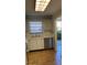 Kitchen features white cabinets, stainless steel dishwasher, and tile flooring at 6070 80Th N St # 109, St Petersburg, FL 33709