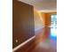 Living room featuring gleaming wood floors and sliding glass door at 6070 80Th N St # 109, St Petersburg, FL 33709