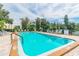 Inviting community pool surrounded by lush landscaping at 6070 80Th N St # 109, St Petersburg, FL 33709
