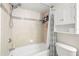 Bathroom featuring a tub and shower combination with tiled walls at 6100 Gulfport S Blvd # 414, Gulfport, FL 33707