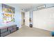 Well-lit bedroom featuring a closet, adjacent doorway, and playful decorations at 6100 Gulfport S Blvd # 414, Gulfport, FL 33707