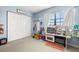 Bright bedroom features ample closet space and a play kitchen near a window at 6100 Gulfport S Blvd # 414, Gulfport, FL 33707