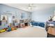 bedroom with a twin bed, ceiling fan and light blue walls at 6100 Gulfport S Blvd # 414, Gulfport, FL 33707