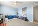 bedroom with a twin bed, ceiling fan and light blue walls at 6100 Gulfport S Blvd # 414, Gulfport, FL 33707