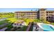 A view of the luxurious exterior, landscaping, and pool at 6100 Gulfport S Blvd # 414, Gulfport, FL 33707