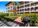 Outdoor patio area features a grill, lush gardens, and a walkway at 6100 Gulfport S Blvd # 414, Gulfport, FL 33707
