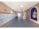 Interior hallway features mailboxes, a blue-tiled alcove, and lighting at 6100 Gulfport S Blvd # 414, Gulfport, FL 33707