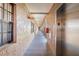 Indoor hallway view includes an elevator and an exit sign at 6100 Gulfport S Blvd # 414, Gulfport, FL 33707