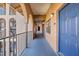 Exterior hallway with arched openings, view of complex at 6100 Gulfport S Blvd # 414, Gulfport, FL 33707