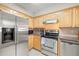 Functional kitchen equipped with stainless steel appliances, sleek counter-tops and plenty of storage space at 6100 Gulfport S Blvd # 414, Gulfport, FL 33707