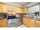 Beautiful kitchen featuring tile backsplash, stainless steel appliances, and lots of cabinets for storage at 6100 Gulfport S Blvd # 414, Gulfport, FL 33707