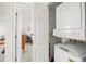 A laundry area with stacked washer and dryer at 6100 Gulfport S Blvd # 414, Gulfport, FL 33707
