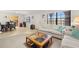 Open-concept living/dining area, the tile flooring connects living spaces seamlessly, enhancing the flow of the home at 6100 Gulfport S Blvd # 414, Gulfport, FL 33707