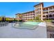Exterior view of complex featuring a pool and lounge area at 6100 Gulfport S Blvd # 414, Gulfport, FL 33707